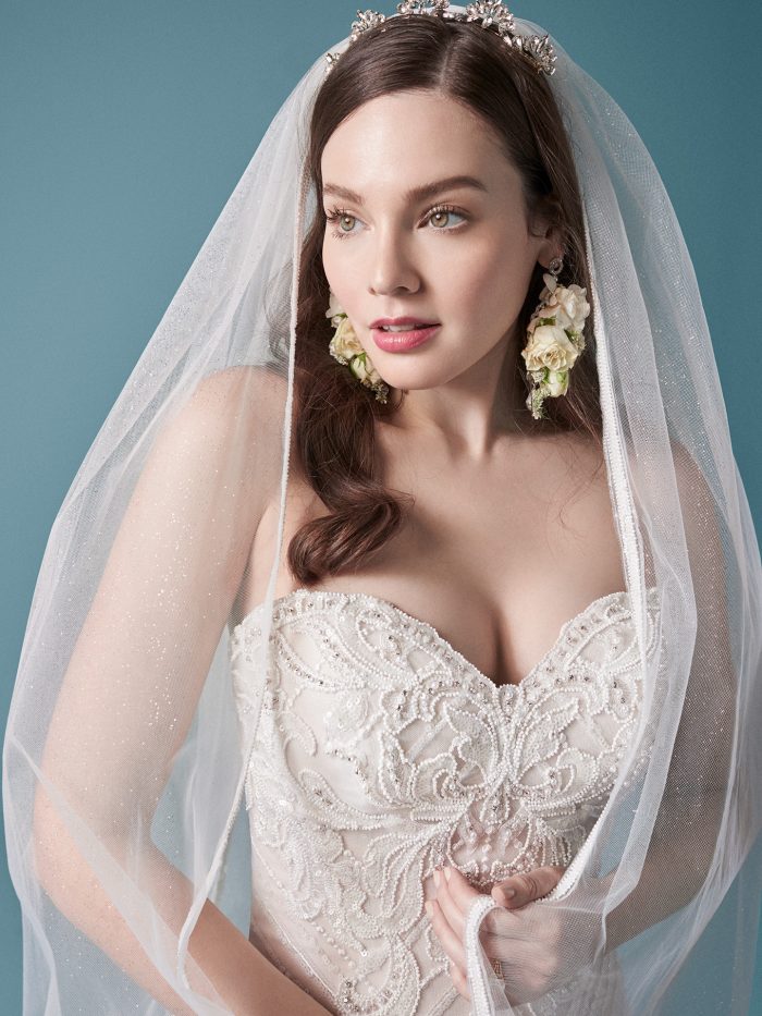 Model Wearing Tulle Trumpet Wedding Dress with Embroidered Lace Wedding Veil Called Gideon by Maggie Sottero