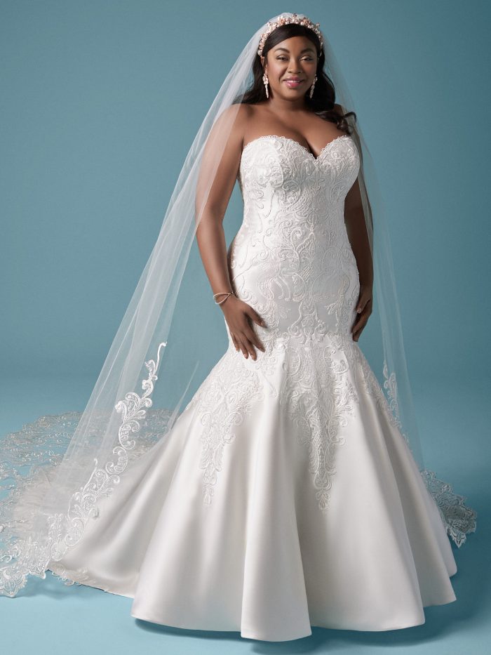 Plus Size Model Wearing Embroidered Lace Mermaid Wedding Dress and Vintage Wedding Veil Called Milena by Maggie Sottero