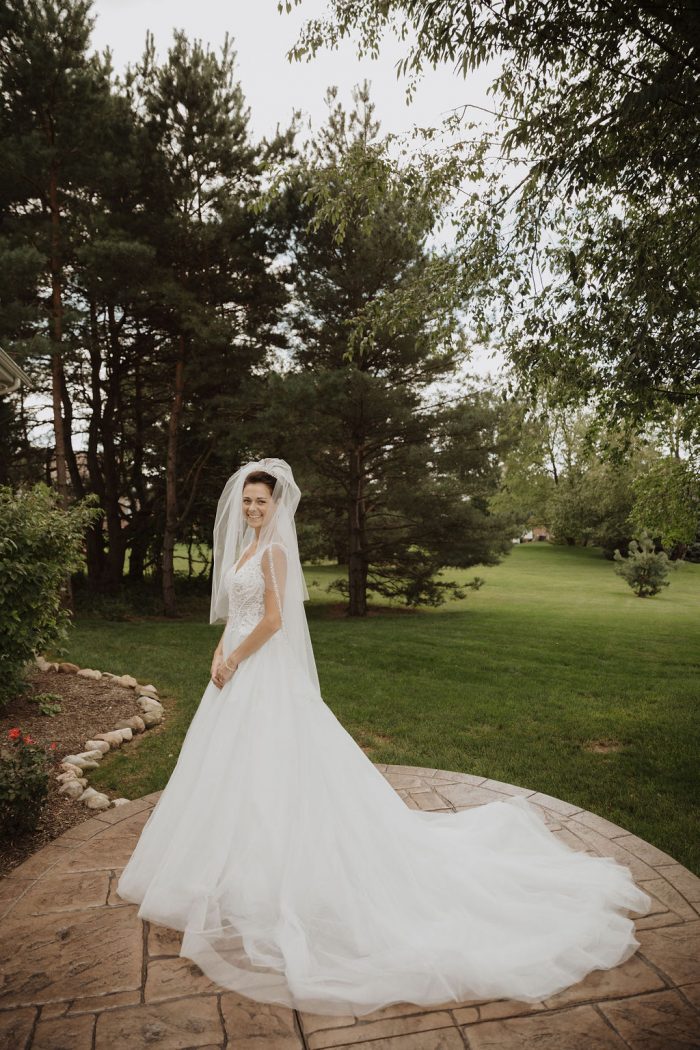 Bride Wearing Veil and Modern Princess Wedding Dress Called Taylor Lynette by Maggie Sottero