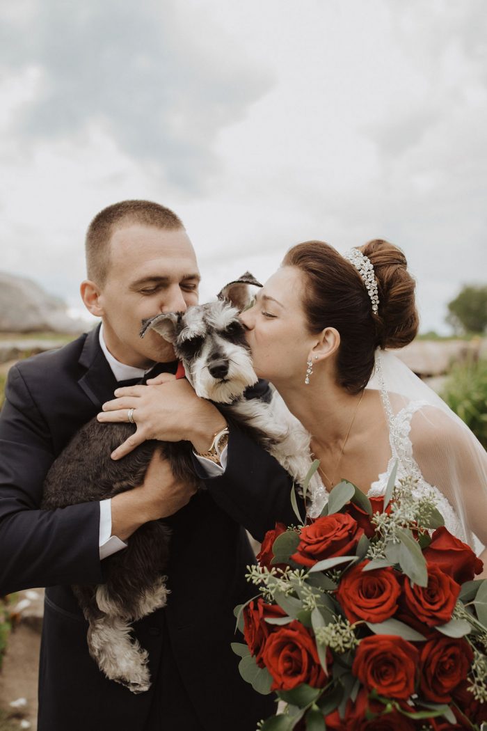Bride and Groom Standing with Their Dog