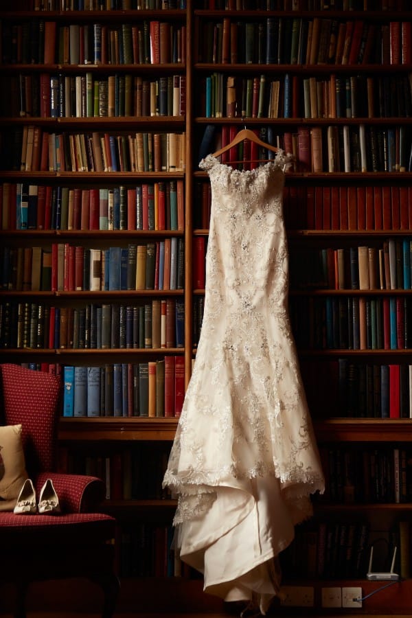 Wedding Dress by Maggie Sottero hanging in Library at Vintage Wedding