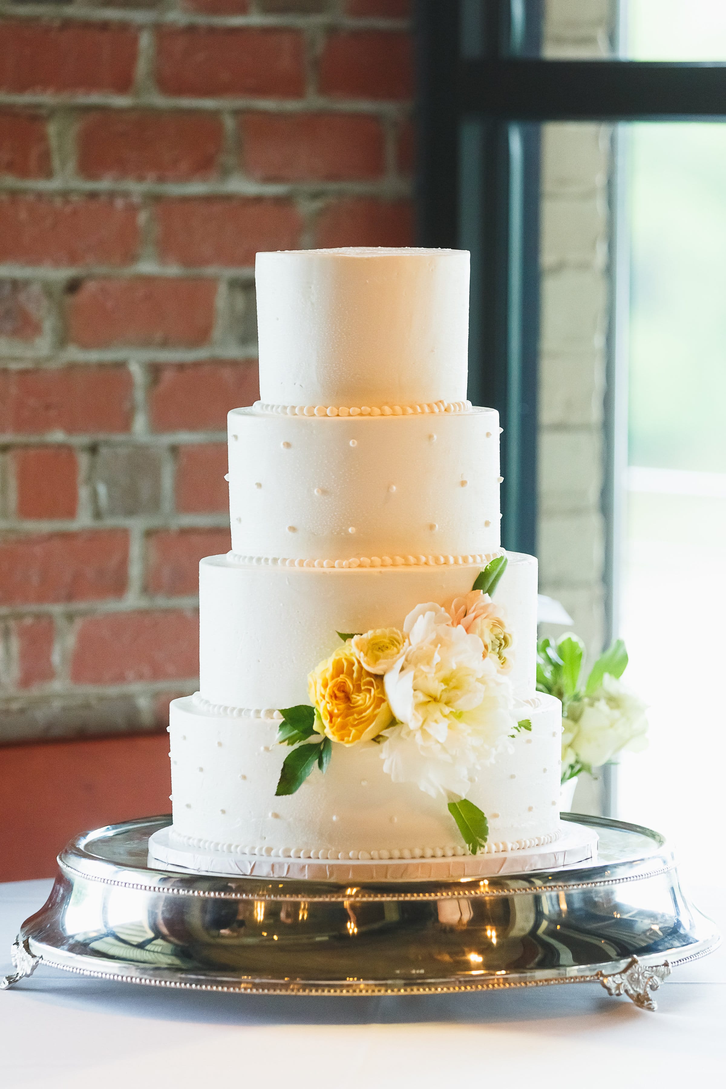 White Wedding Cake with Pearls at Wedding 