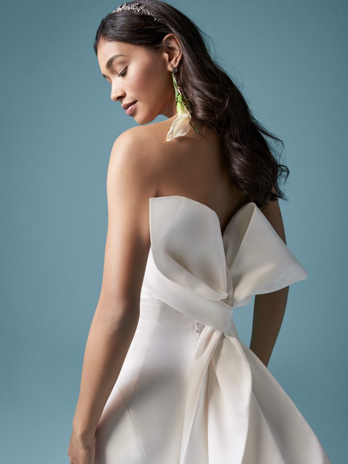 Model Wearing Unique Satin Bridal Dress with Bow in Back Called Mitchel by Maggie Sottero