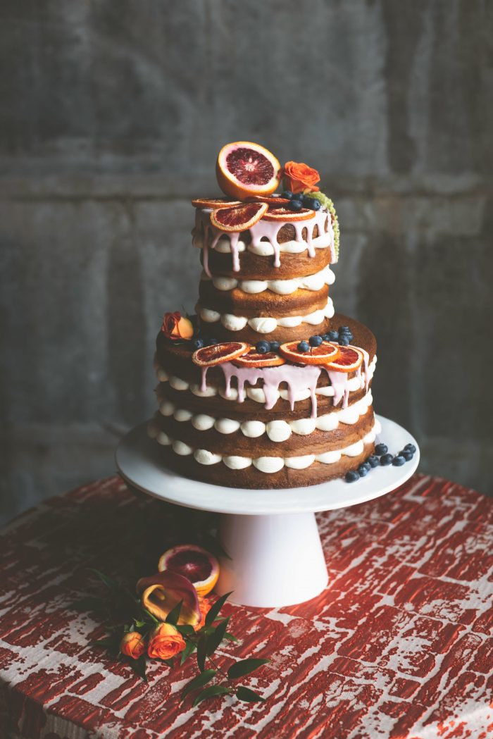 Fall Wedding Cake with Citrus Accents and Oranges on Top