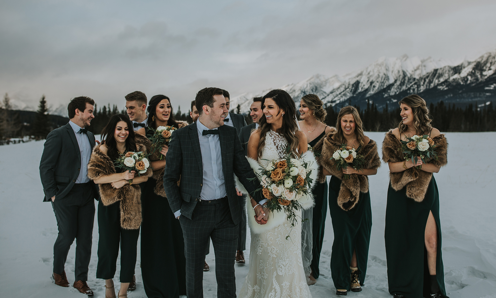 Bride and Groom with Wedding Party in Snow Covered Mountains at Off Season Wedding