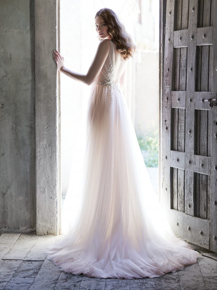 Model From Back Wearing V-back Wedding Dress Called Meletta by Maggie Sottero