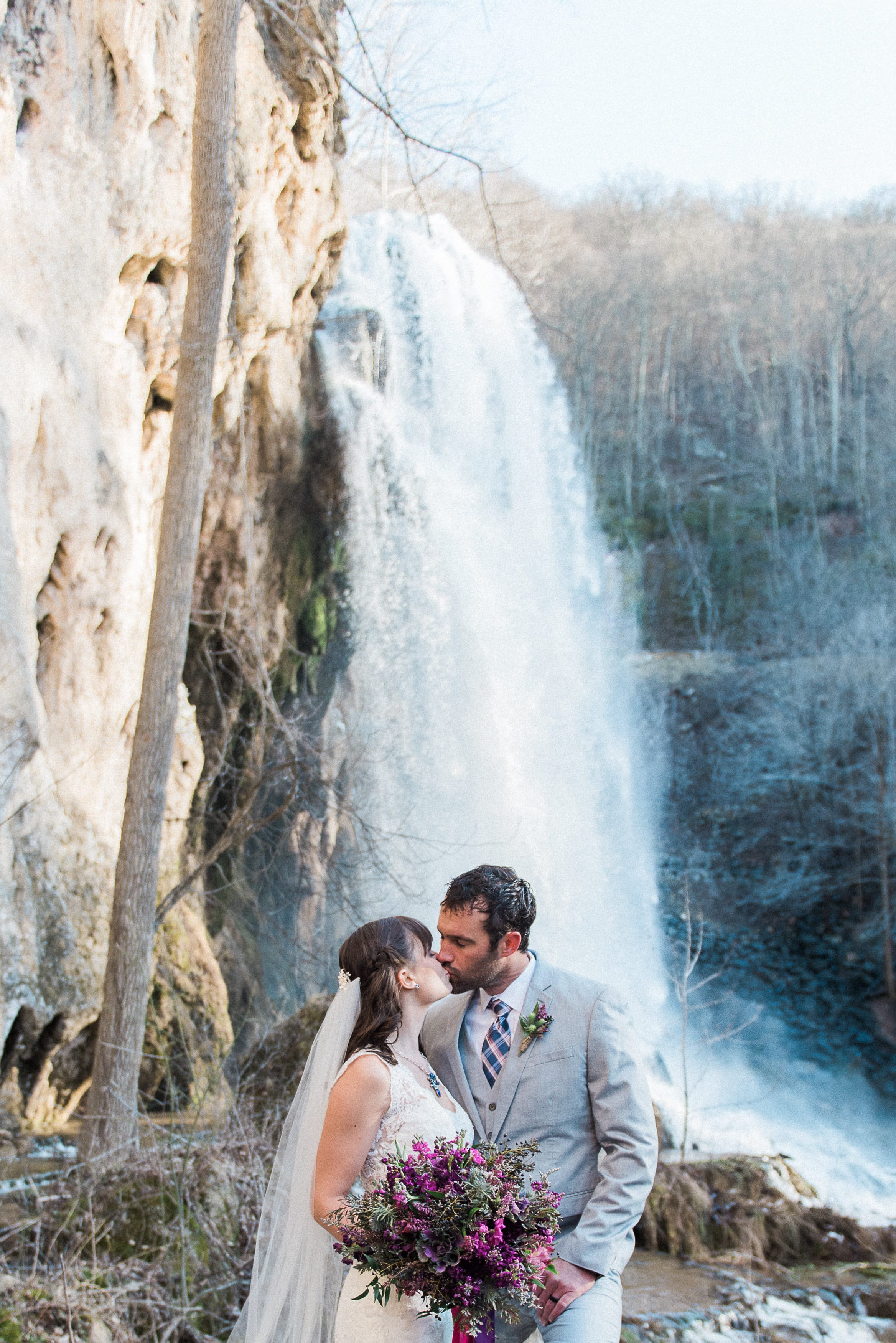 Lace Gown Melanie with Jewel Tones and Waterfall - Maggie Sottero's Melanie gown styled with a jewel-tone wedding palette and a waterfall wedding venue.