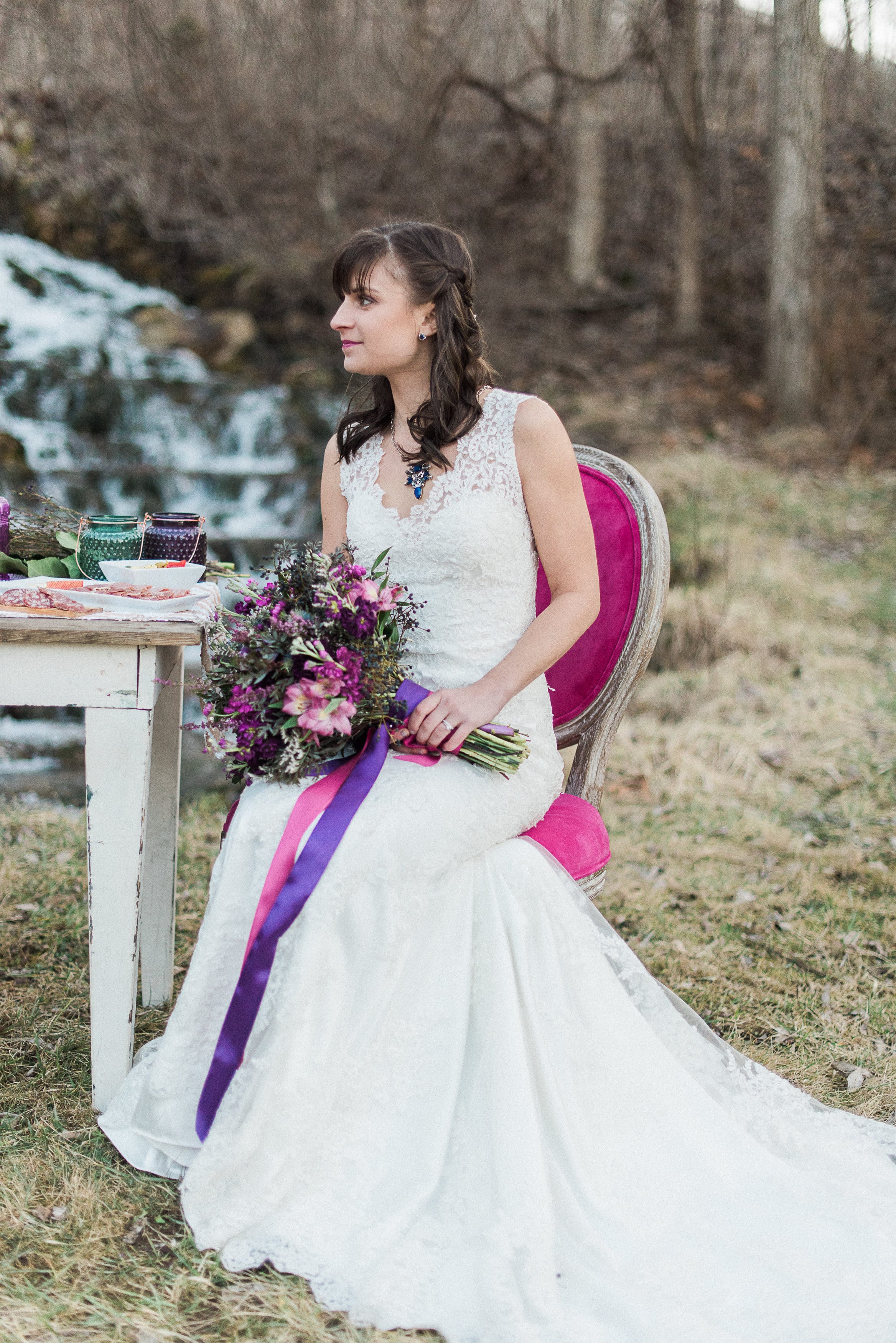 Lace Gown Melanie with Jewel Tones and Waterfall - Maggie Sottero's Melanie gown styled with a jewel-tone wedding palette and a waterfall wedding venue.