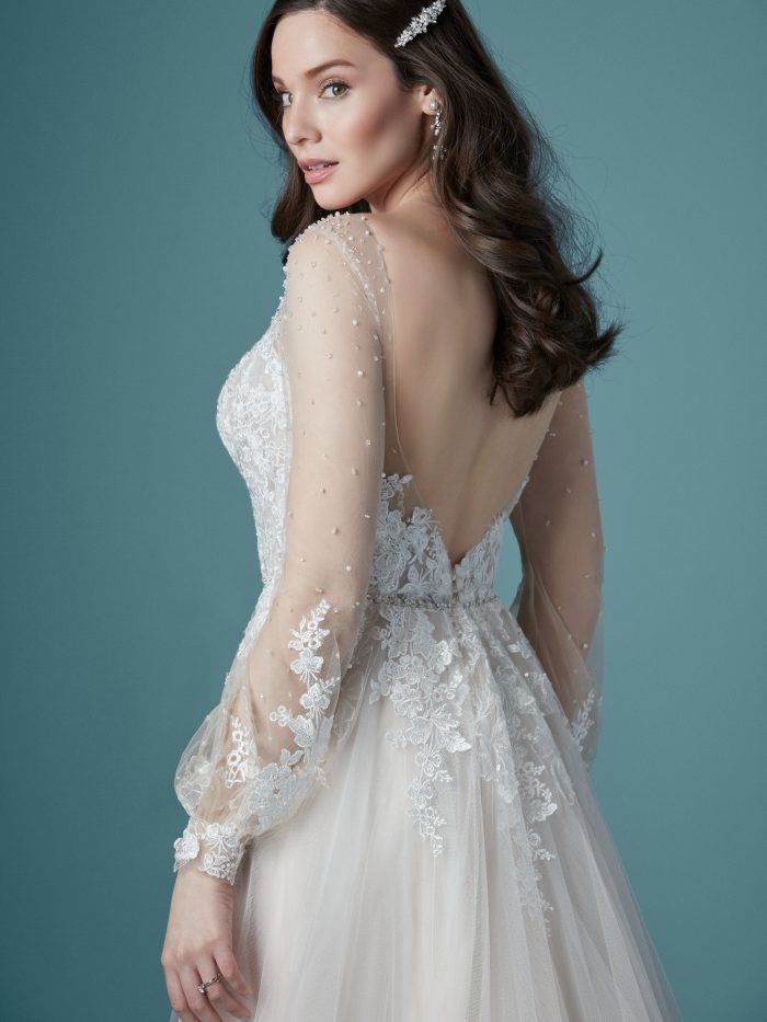 Model Wearing Boho Illusion Long Sleeve Wedding Gown Called Pamela by Maggie Sottero