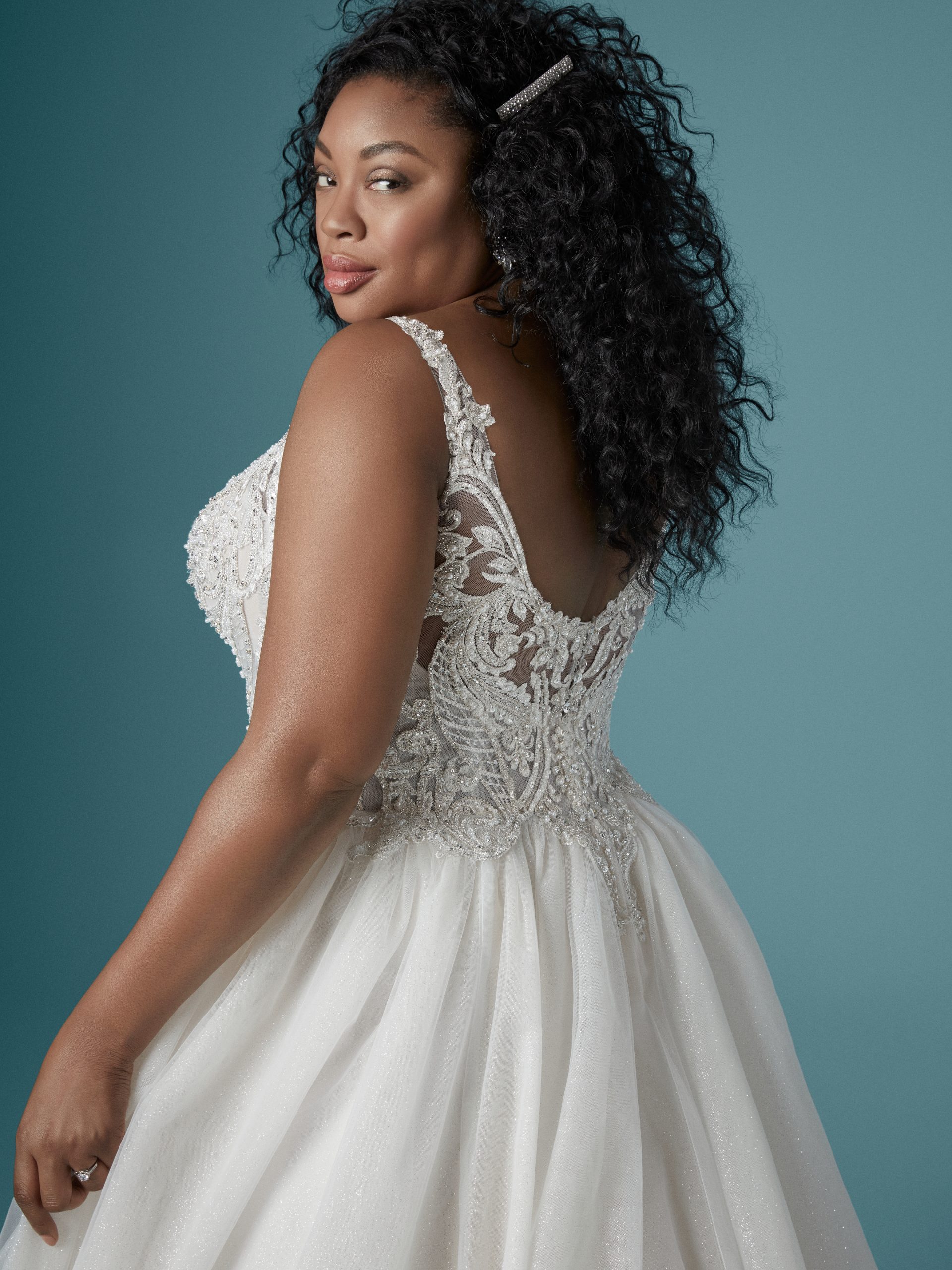 Model Wearing Plus Size V-neck Ball Gown Wedding Dress Called Taylor Lynette by Maggie Sottero