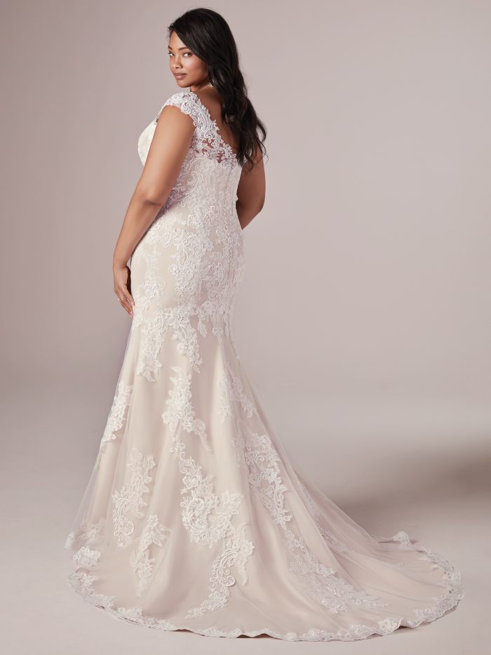 Plus Size Model Wearing Lace Fit and Flare Wedding Dress Called Daphne Lynette by Rebecca Ingram