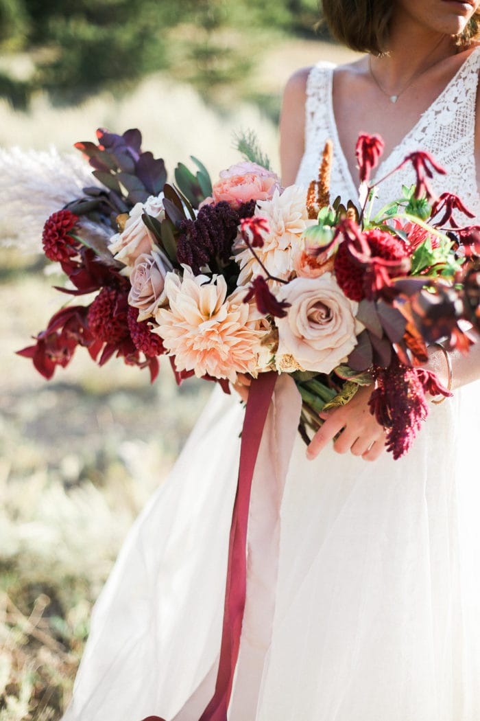 Bride holding colorful bridal bouquet