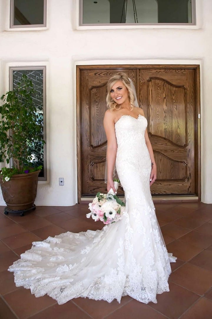 Elegant Celebration with Lace Wedding Gown, Classic Cars, and Flirty Details. Jennita wedding dress by Maggie Sottero.