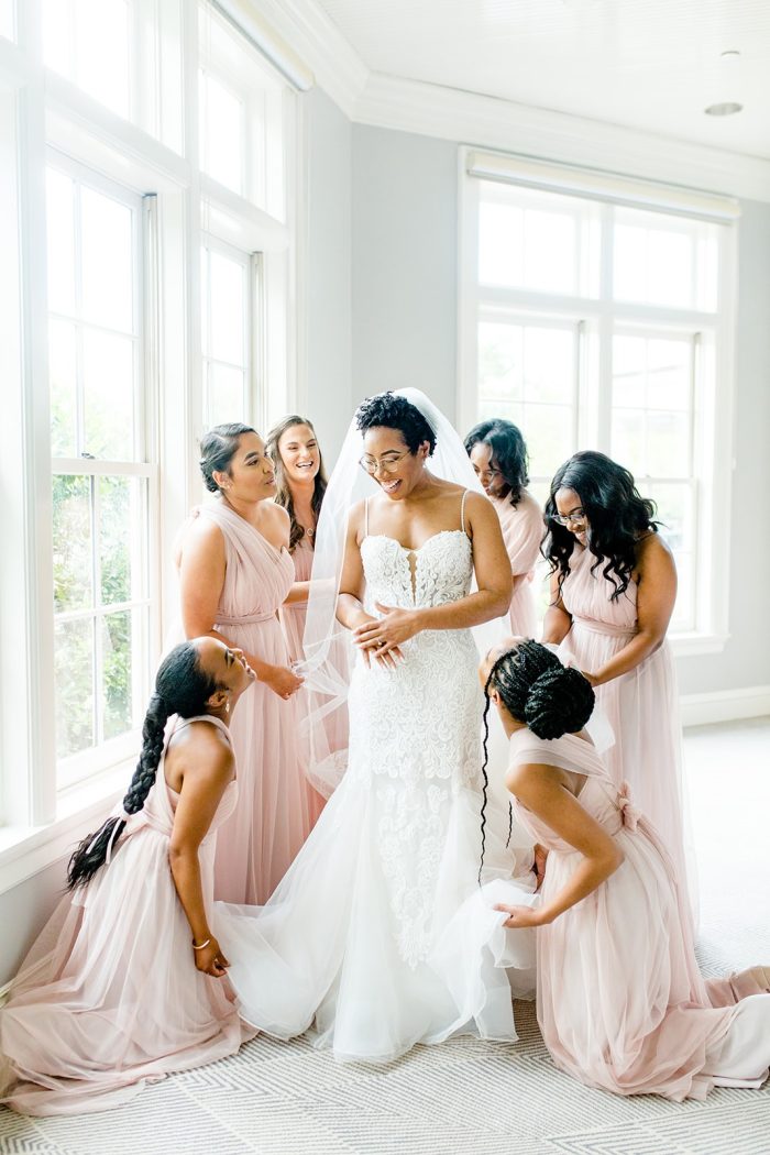 Bride Standing With Bridesmaids Wearing A Dress Called Alistaire By Maggie Sottero