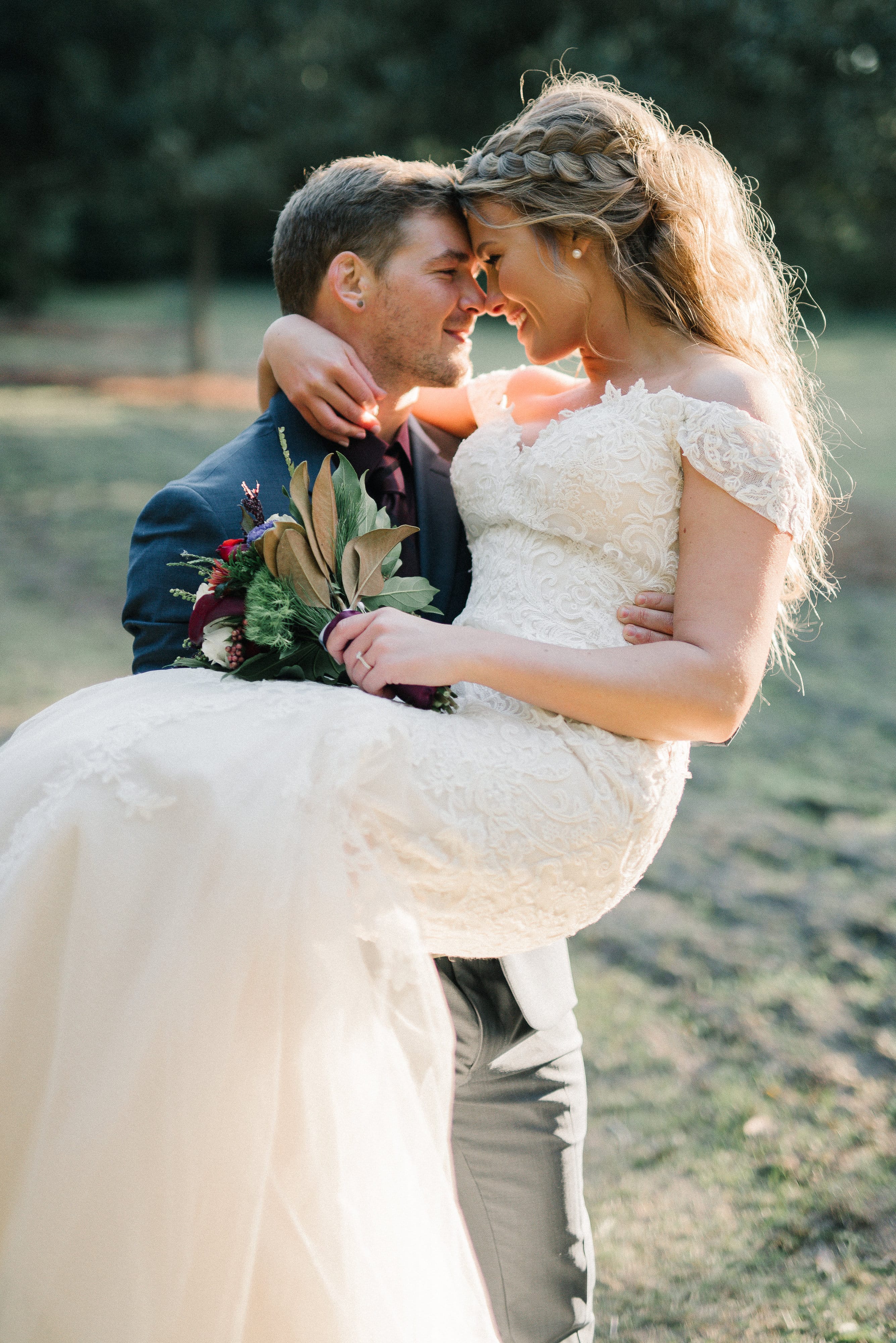 Groom Kissing Real Bride Wearing Maggie Sottero Wedding Dress