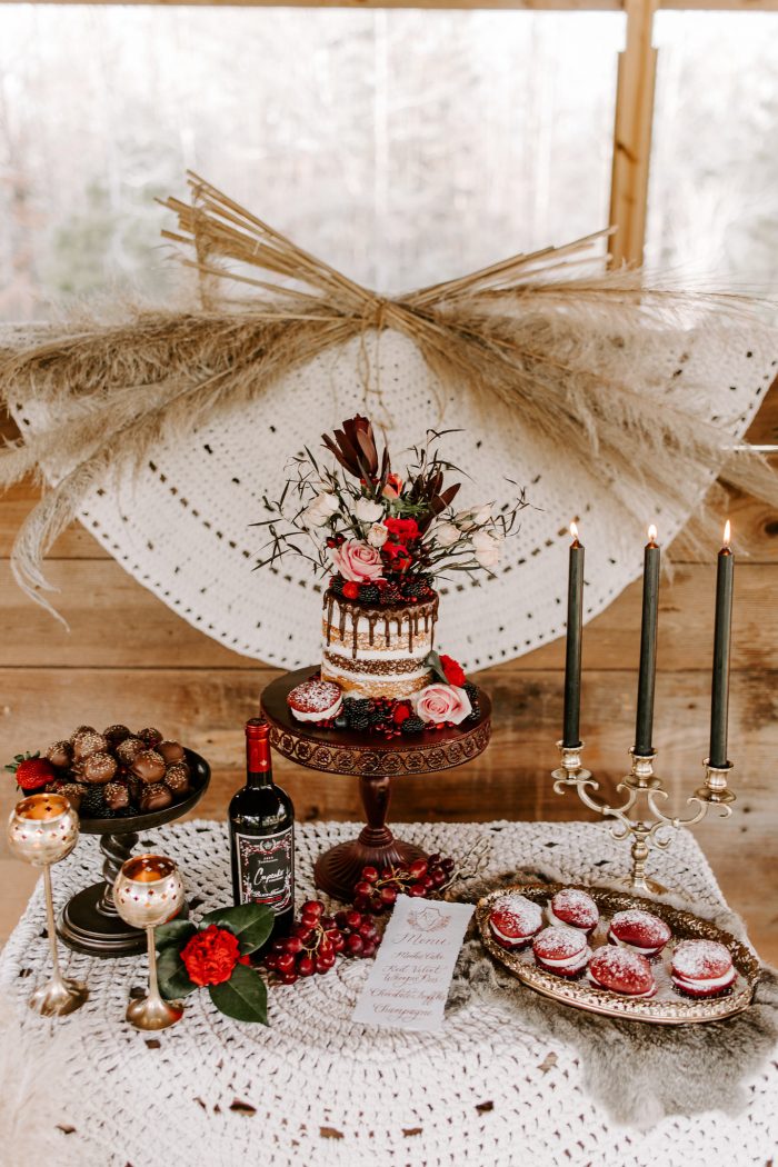 Valentine's Wedding Cake on Dessert Table with Vintage Candles and Red Velvet Cookies