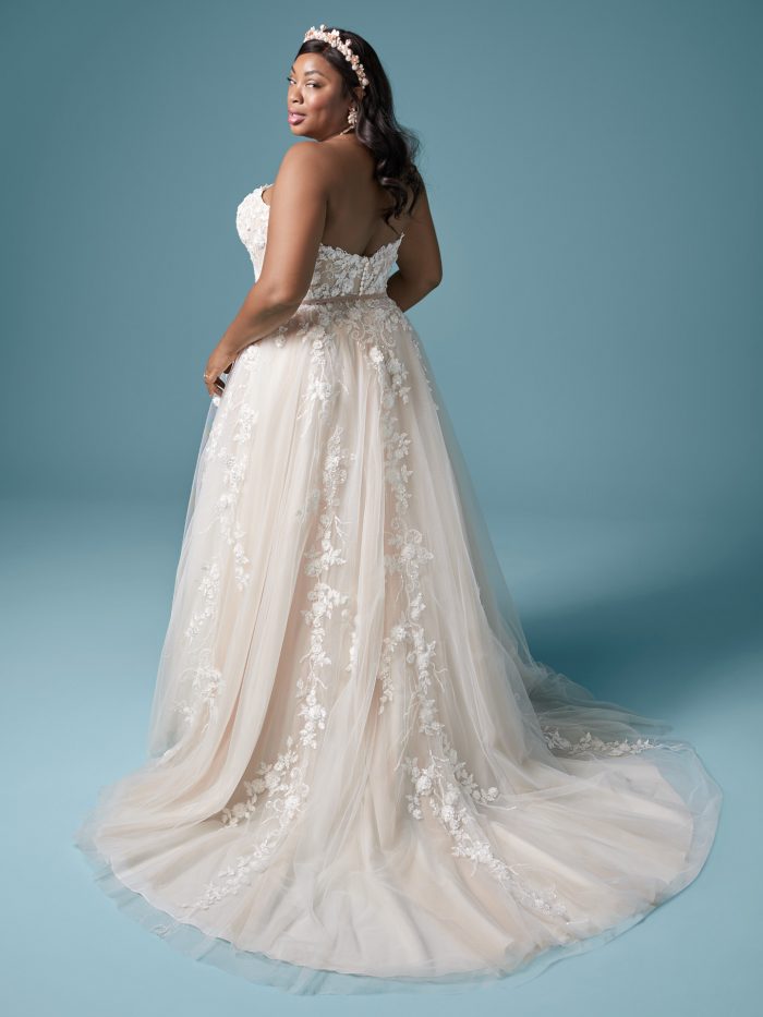 Curvy Model Wearing Plus Size Floral A-line Bridal Dress Called Zareen Lynette by Maggie Sottero