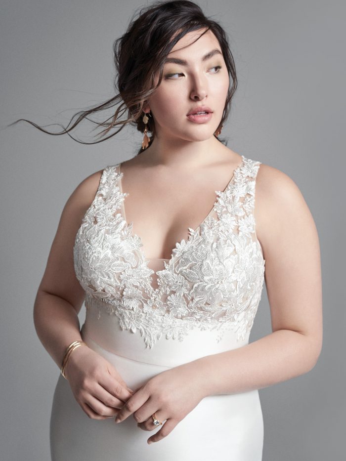 Plus Size Model Wearing Plus Size Mikado Sheath Wedding Dress Called Boden by Sottero and Midgley