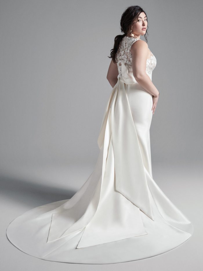 Plus Size Model Wearing Plus Size Mikado Sheath Wedding Dress Called Boden by Sottero and Midgley