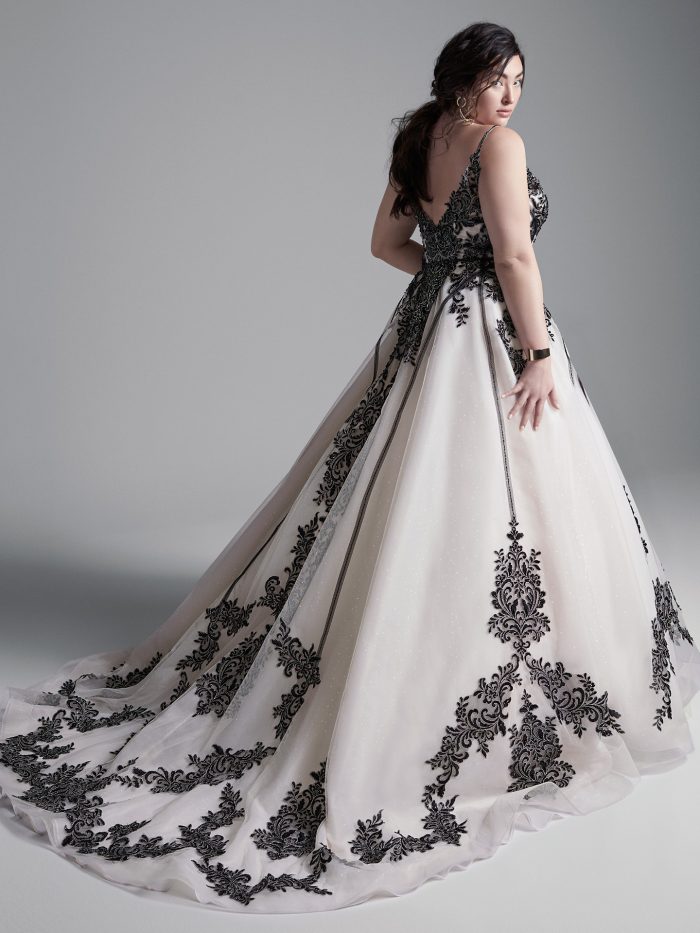 Plus Size Model Wearing Plus Size Black Lace Wedding Dress Called Santiago by Sottero and Midgley