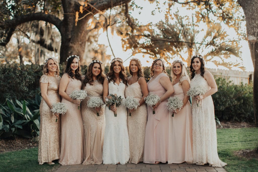 Boho Bride Standing with Bridesmaids During Real Beach Wedding