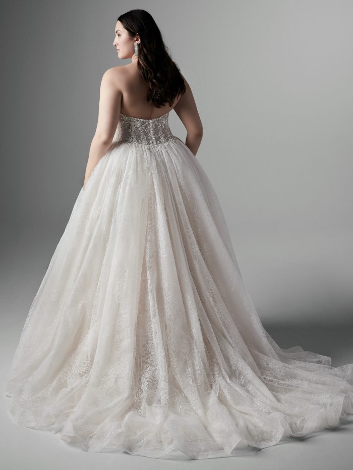 Plus Size Model Wearing Halter Neck Ballgown Wedding Dress Called Thaddeus by Sottero and Midgley