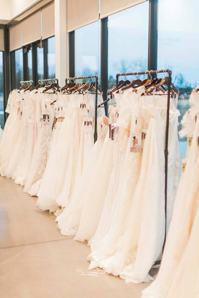 Dress racks filled with Maggie Sottero and Sottero and Midgley gowns