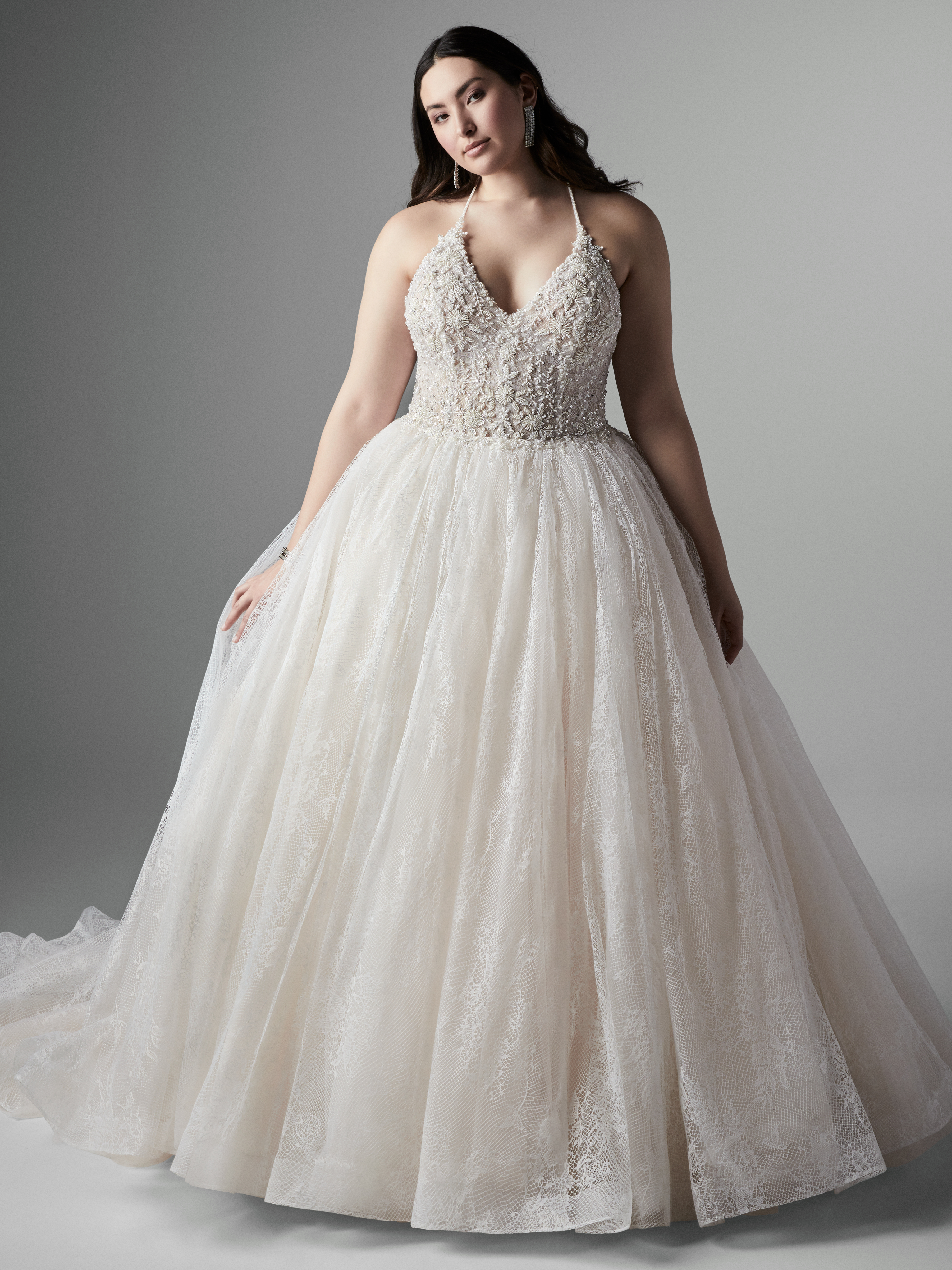Model Wearing Plus Size Halter Neck Ball Gown Called Thaddeus by Sottero and Midgley