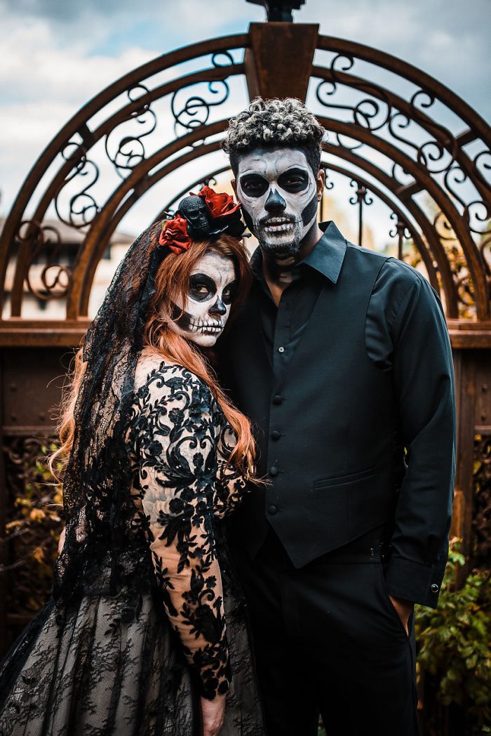 Bride and Groom Wearing Dramatic Skull Makeup for a Halloween Wedding