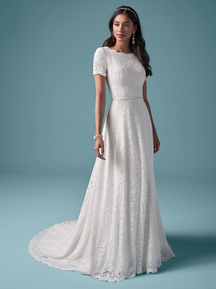 Model Wearing Modest Cap-sleeve A-line Wedding Dress Called Prescott by Maggie Sottero