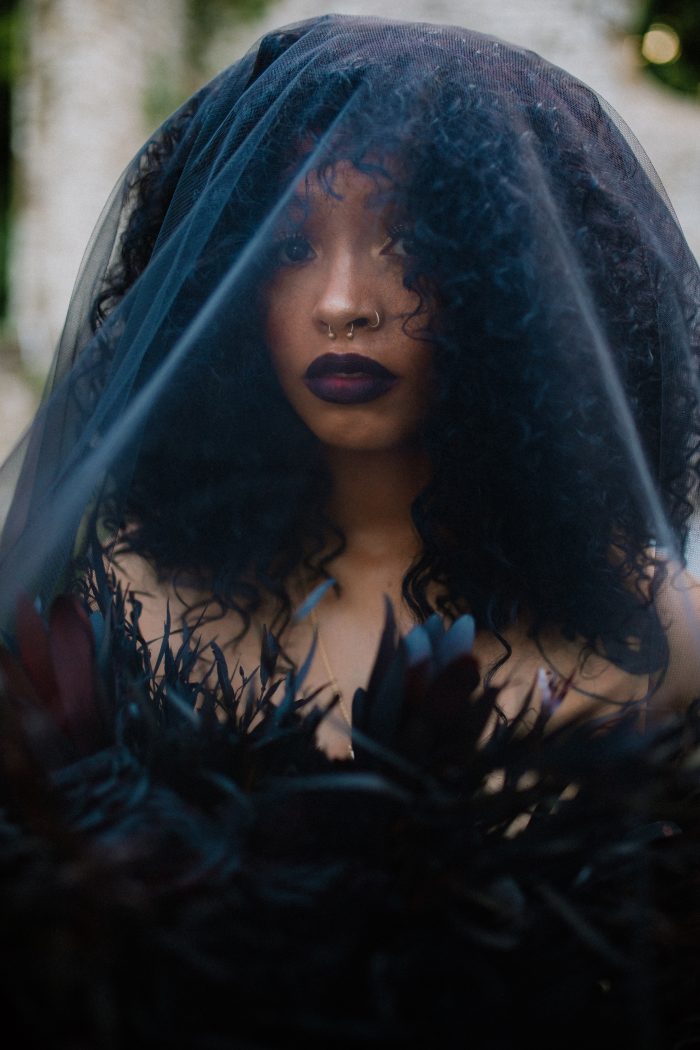 Real Black Bride Wearing Dramatic Halloween Makeup with Black Veil