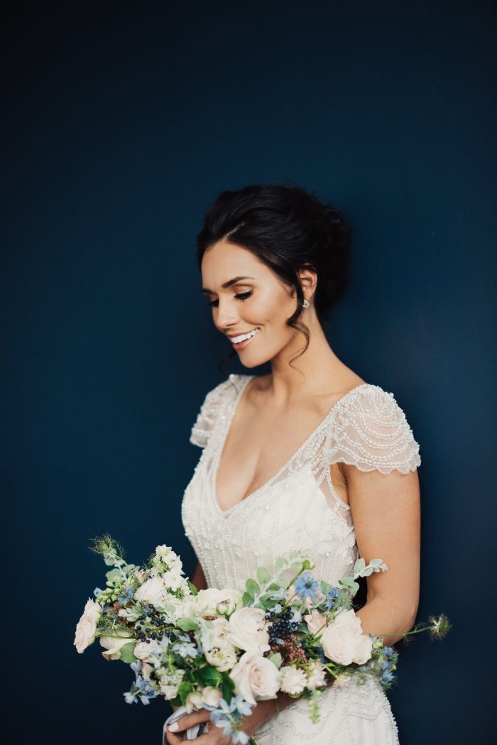 Bride Wearing Vintage Wedding Dress Called Ettia by Maggie Sottero with Blue and Blush Bouqet