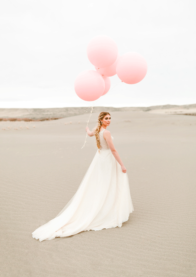 Bride Holding Balloons Wearing Sparkly Wedding Dress Called Jarret by Sottero and Midgley