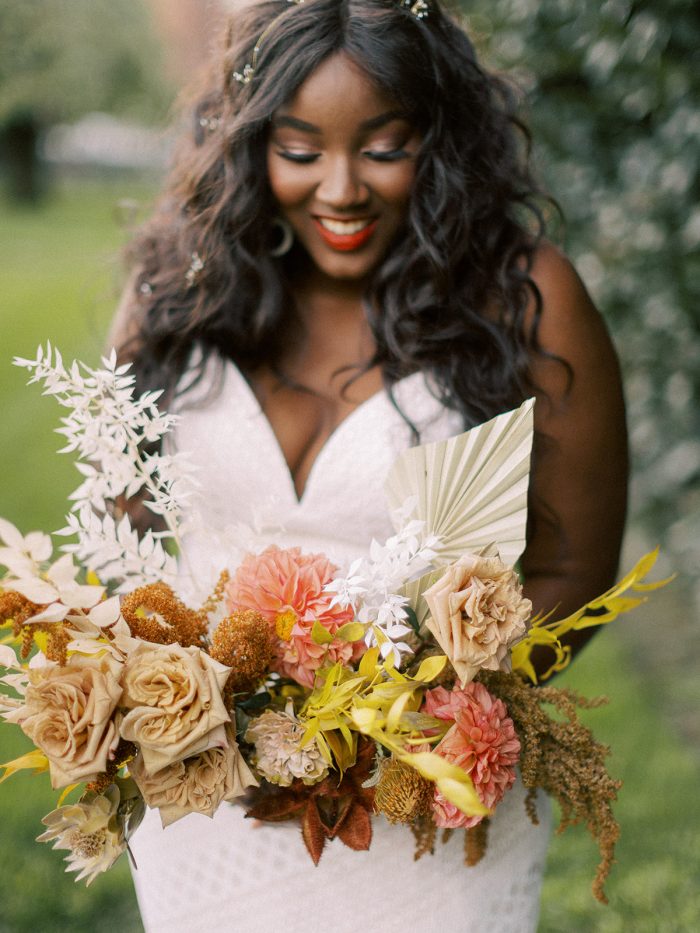 Bride with Bouquet Wearing Boho Bridal Gown Called Lilana by Maggie Sottero