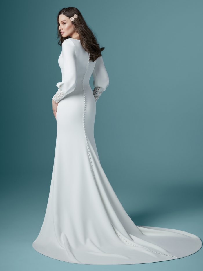Model From Back Wearing Bishop Sleeve Crepe Wedding Gown by Maggie Sottero