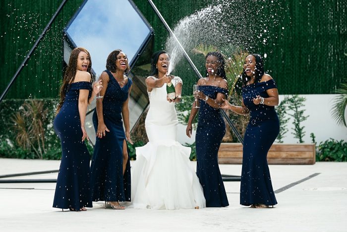 Bride and Bridesmaids with Bride wearing Raquelle wedding dress by Sottero and Midgley