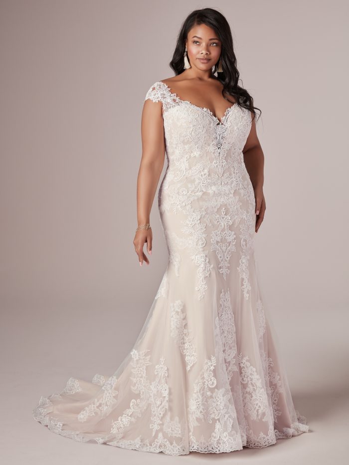 Plus Size Model Wearing Lace Fit and Flare Wedding Dress Called Daphne Lynette by Rebecca Ingram