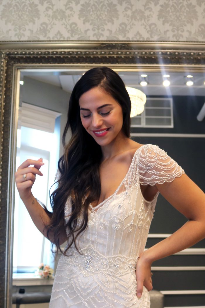 Real bride influencer trying on vintage wedding dress called Ettia by Maggie Sottero