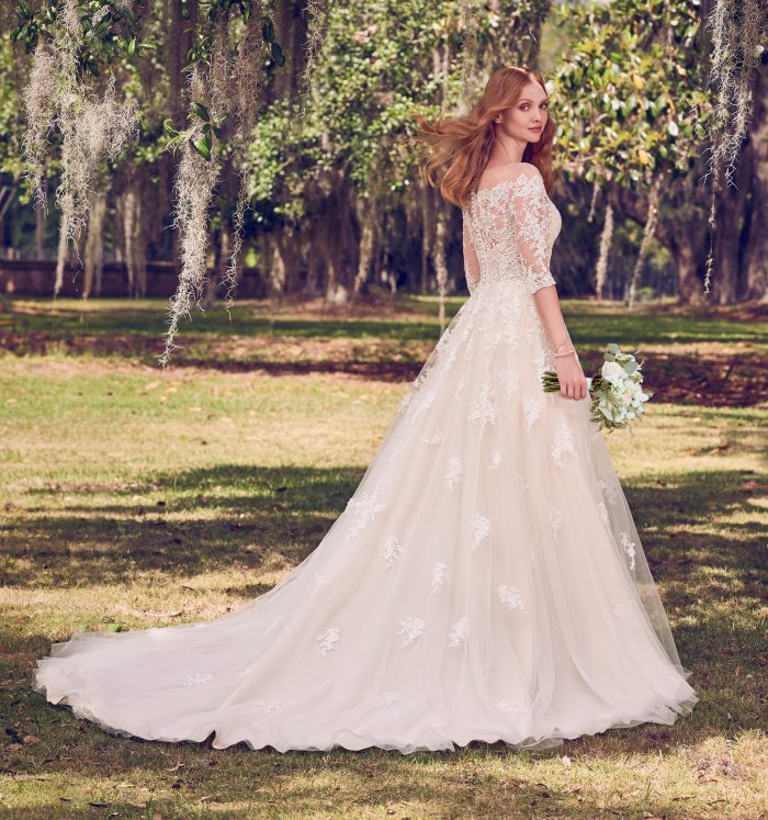 Model Wearing Off-the-Shoulder Wedding Gown Called Bree by Maggie Sottero