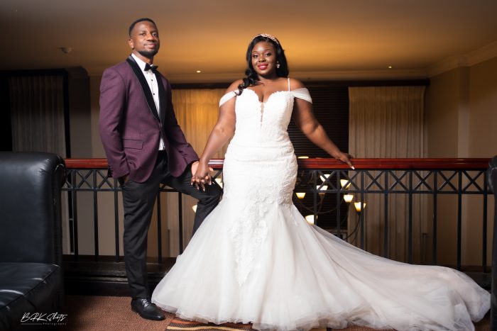 Curvy Bride Standing With Her Husband Wearing A Mermaid Wedding Dress Called Alistaire Lynette By Maggie Sottero