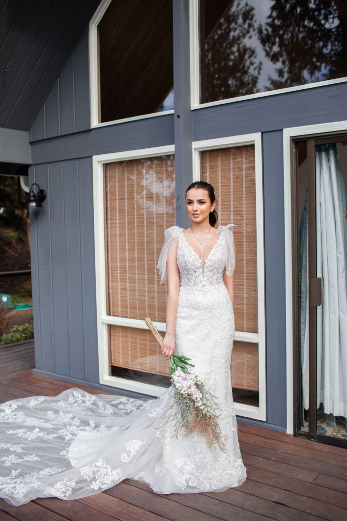 Bride Holding Bouquet Wearing Wedding Dress by Sottero and Midgley Called Easton