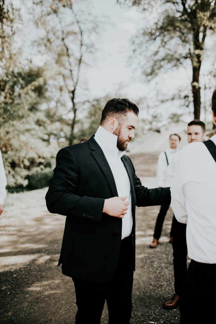 Real Groom Wearing Black Suit and White Dress Shirt