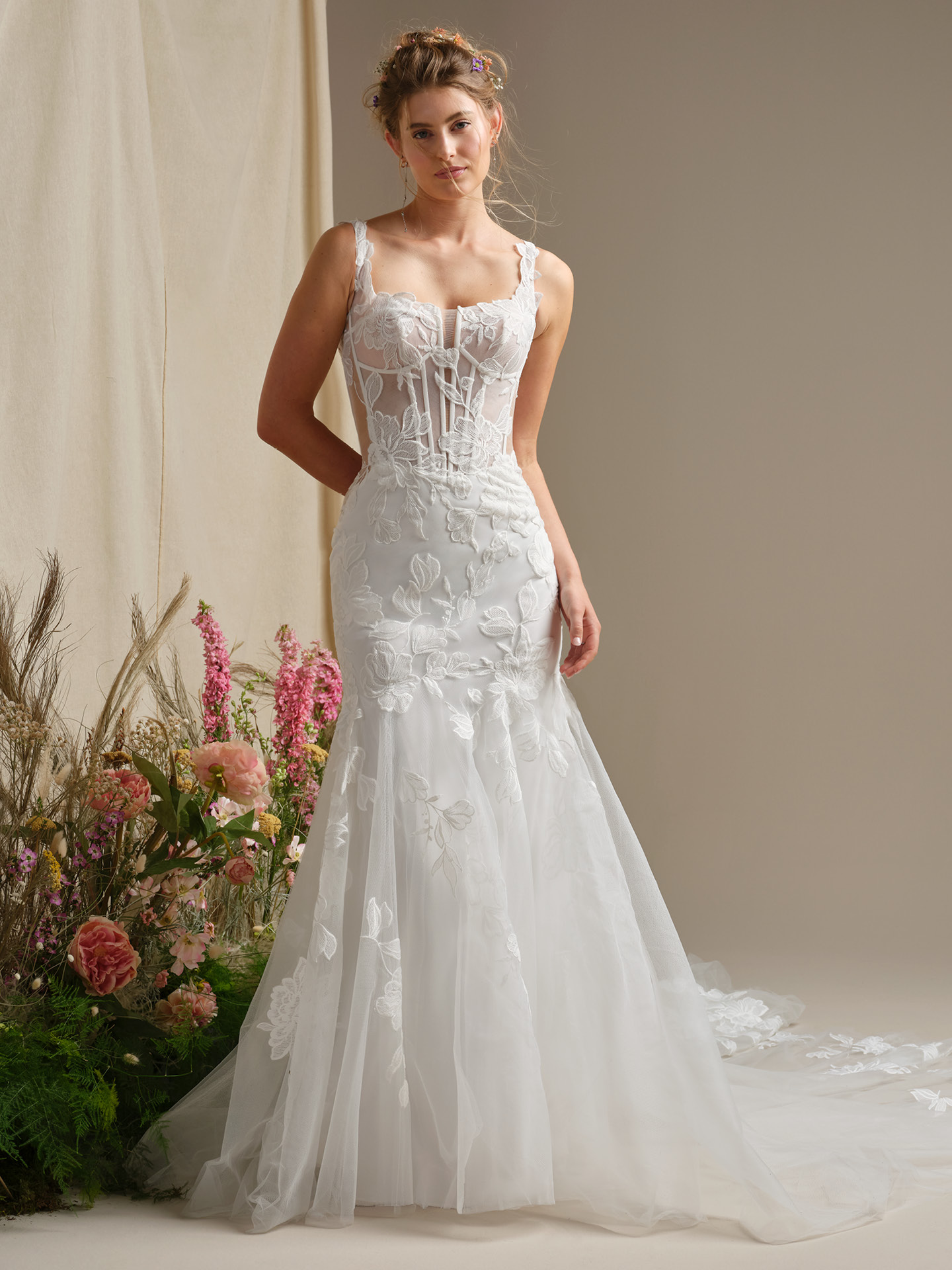Pearline fit-and-flare wedding dress featuring a romantic lace corset bodice with sheer illusion details, supportive straps, and a soft tulle skirt with delicate floral appliqués for an ethereal finish