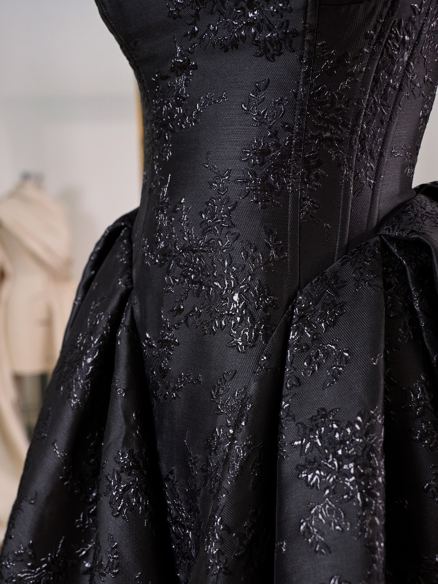 Aberdeen ballgown wedding dress close-up of strapless corset bodice with tonal floral jacquard detailing and sculpted pleating for a dramatic, textured finish