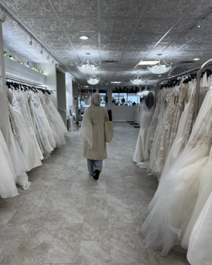 Bride walking through a bridal boutique