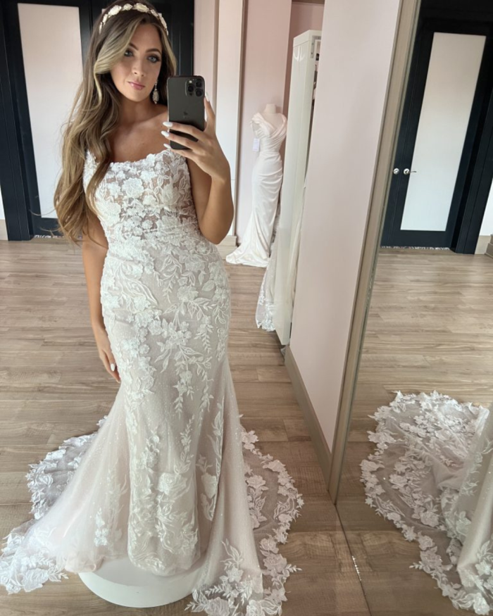 Bride trying on Albany by Maggie Sottero at a bridal boutique