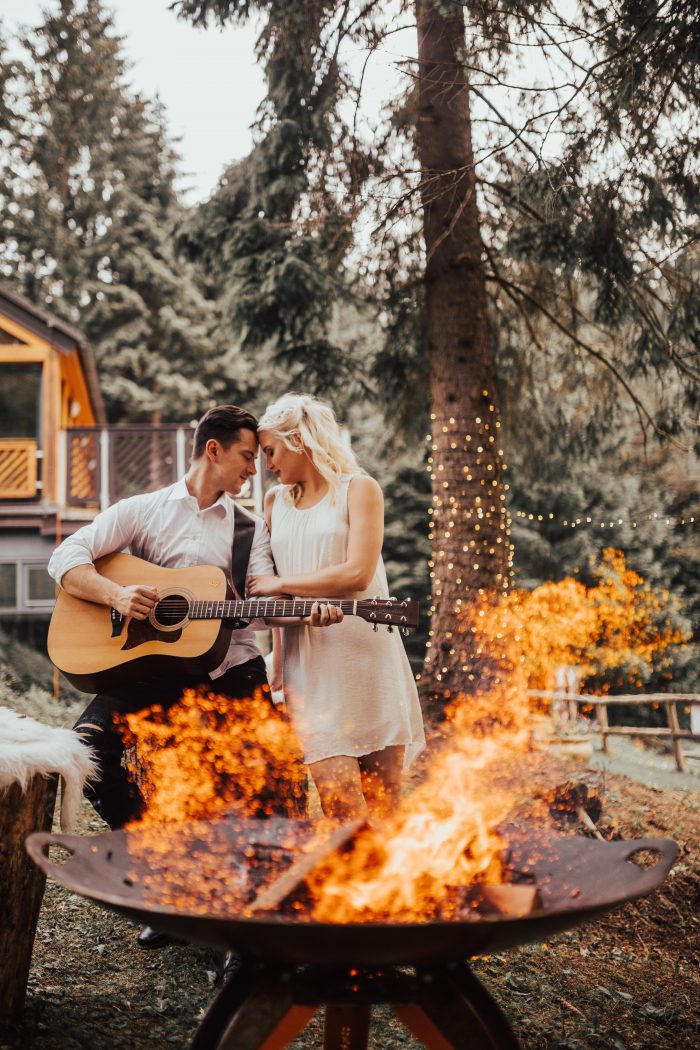 Groom Playing Guitar for Bride at Destination Elopement in Europe