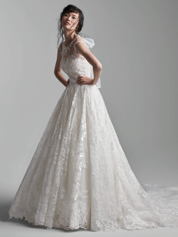 Model Wearing Long Train Ball Gown Wedding Dress Called Xavier by Sottero and Midgley