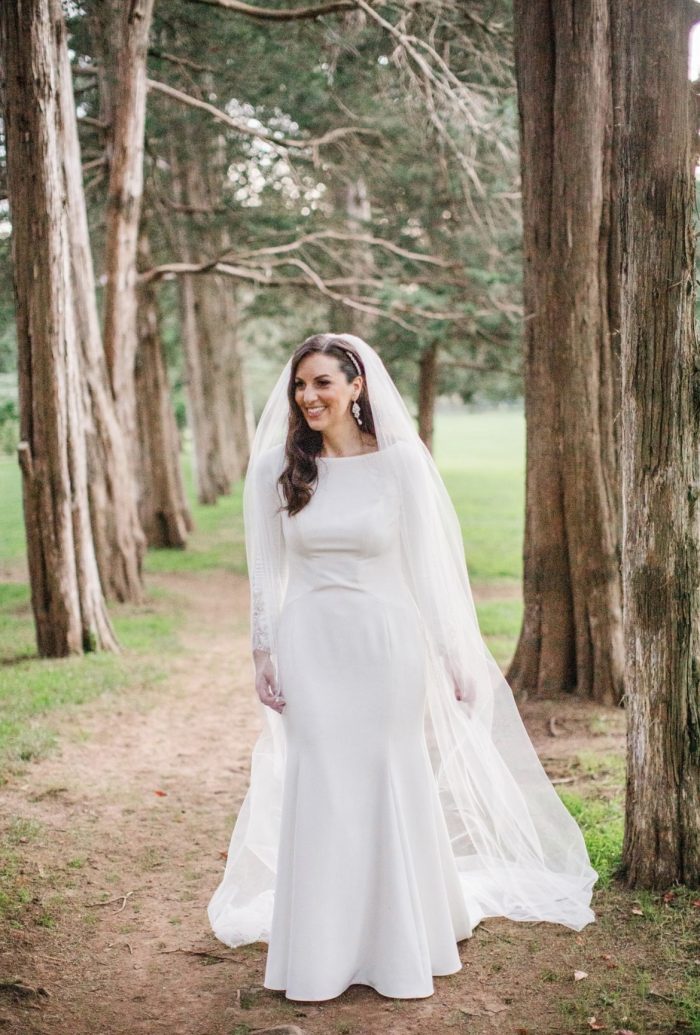 Bride In Sheath Wedding Dress Called Aston By Sottero And Midgley With Long Curls