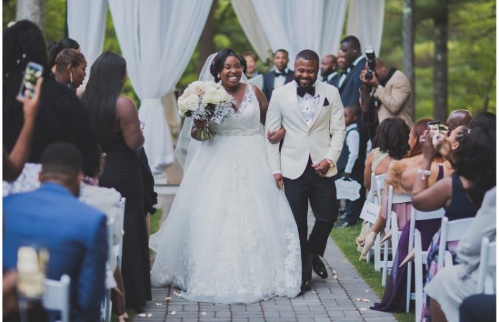 Black Bride and Groom Walking Down the Aisle During Backyard Wedding